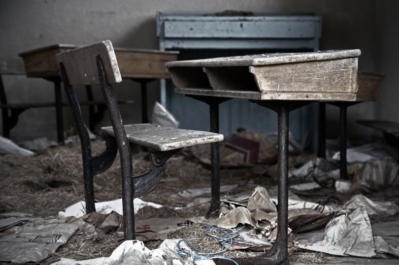 An empty school desk in an empty school