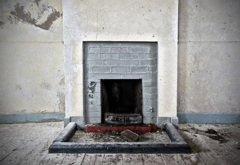 The simple fireplace inside the classroom that kept the schoolmaster and pupils warm in the winter months