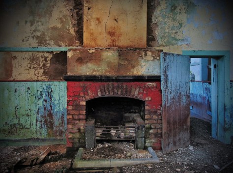 Plate 34 – The brightly coloured fireplace inside one of the classrooms of Ballycastle National School, Carrowkibbock Upper townland, Co. Mayo