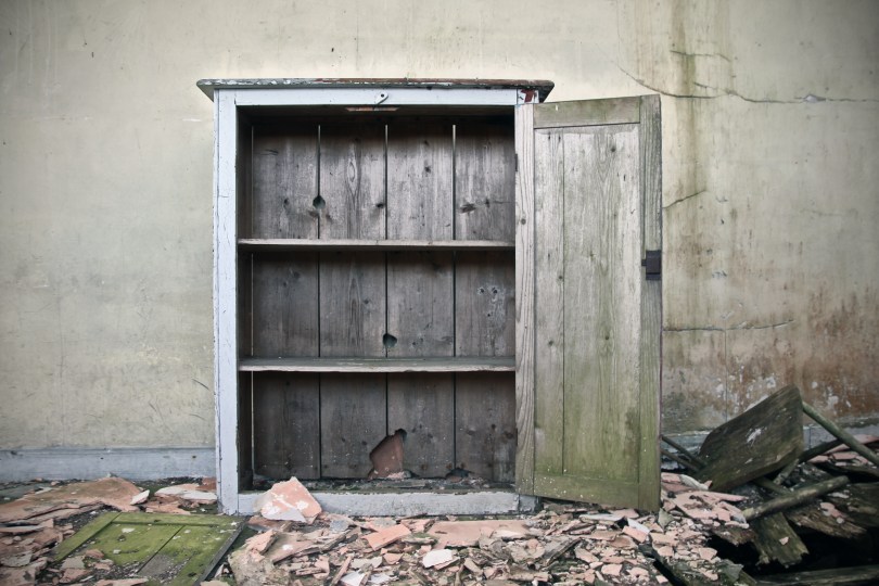 An old cupboard on the disintegrating floor of Brockagh National School