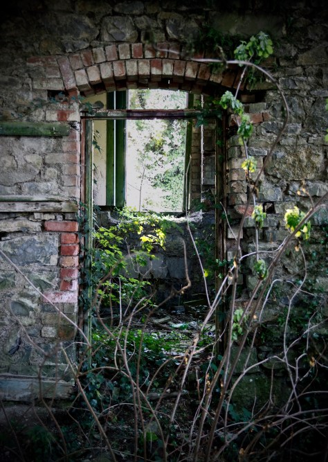 Rathmullan National School, Co. Sligo - crumbling doorway with brickwork arch revealed 